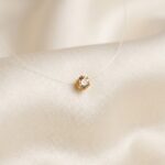 Lant pe fir transparent cu bobita swarovski (taietura briliant) auriu de 2,5 mm